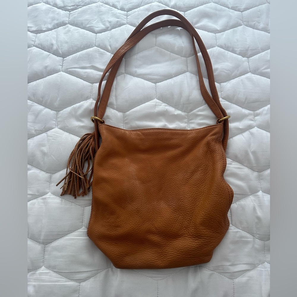 leather back pack or shoulder carry. Caramel color .  11x 10.5